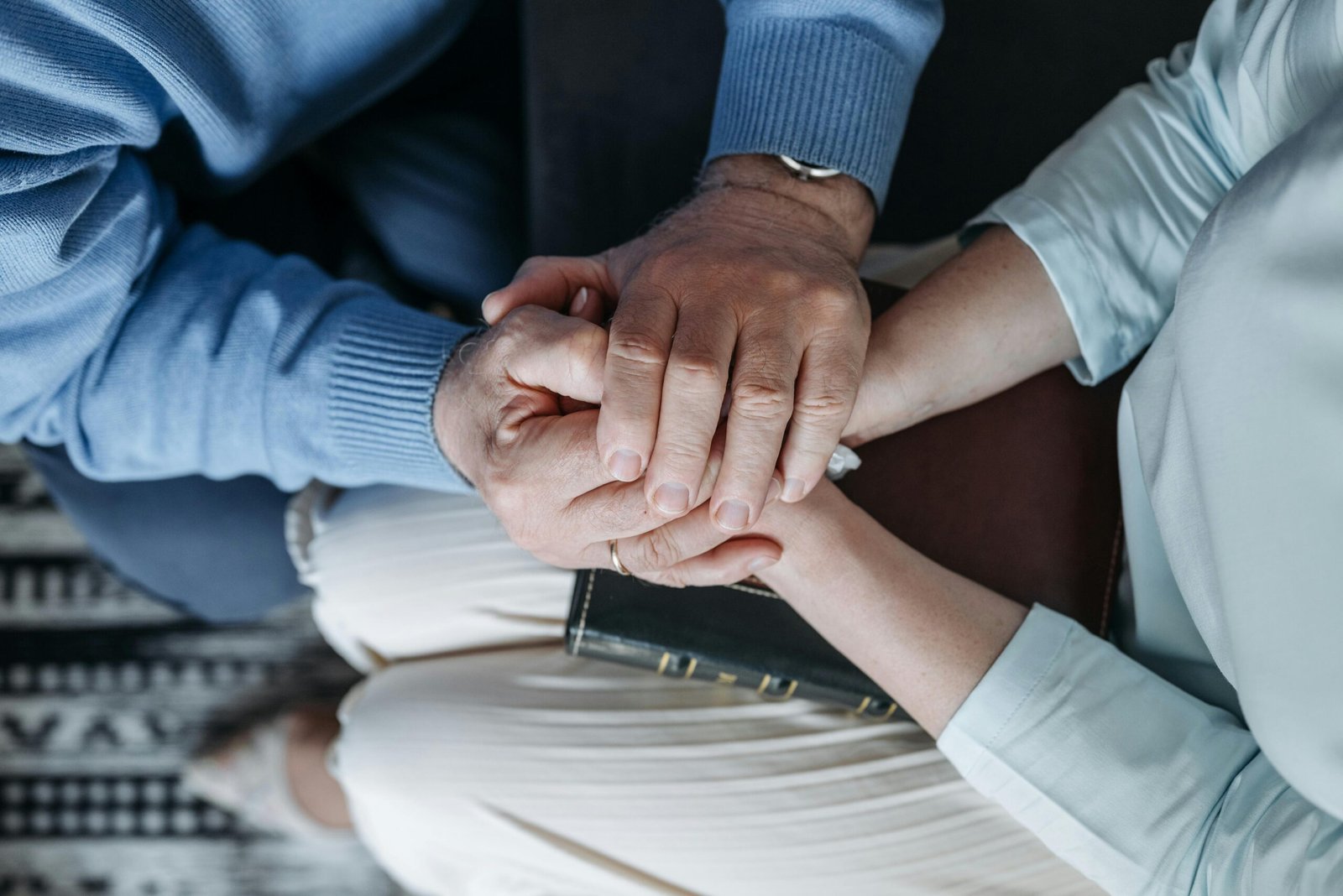 Compassionate hands held together in support and care